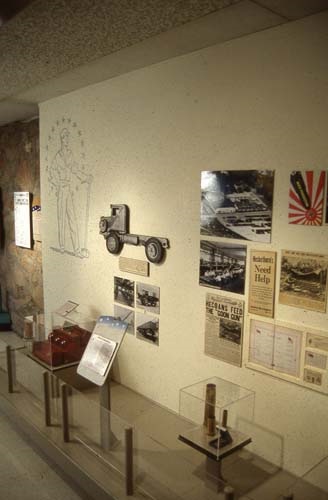 Photo of wall with photos from WWII mounted